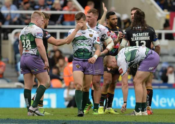 ABJECT: Hull FC players show their dismay at the end of their 45-0 Magic Weekend defeat to St Helens. Picture: Anna Gowthorpe/PA.