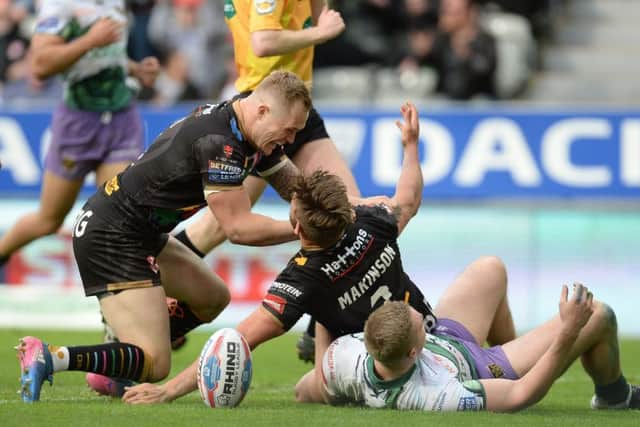 St Helens' Tommy Makinson celebrates his try with Adam Swift. Picture: Anna Gowthorpe/PA.