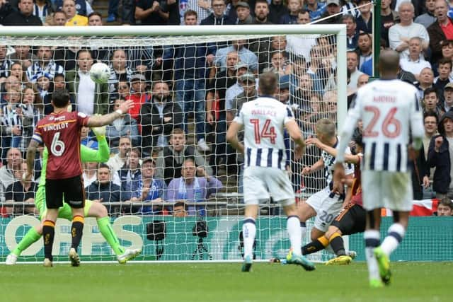 Steve Morrison scores Millwall's winning goal past Colin Doyle. Picture: Bruce Rollinson