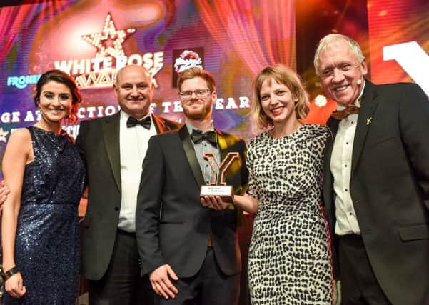 Mike Fraine of Froneri presents ther award to Chris Winter (centre) and Nina Rogers of Yorkshire Sculture Park