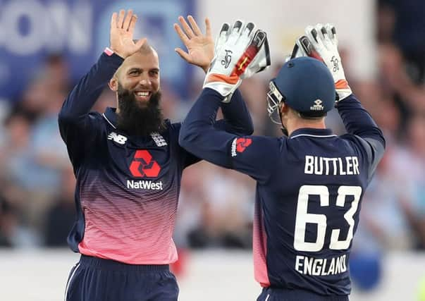 Englands Moeen Ali celebrates with Jos Buttler after taking the wicket of South Africas Chris Morris in their victory over South Africa at Headingley (Picture: Martin Rickett/PA).