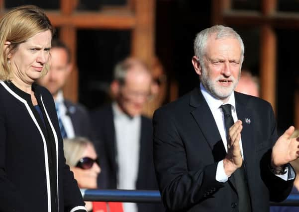 Home Secretary Amber Rudd and Labour leader Jeremy Corbyn during a vigil in Albert Square outside Manchester Town Hall.