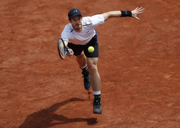 Britain's Andy Murray plays a shot against Switzerland's Stan Wawrinka.