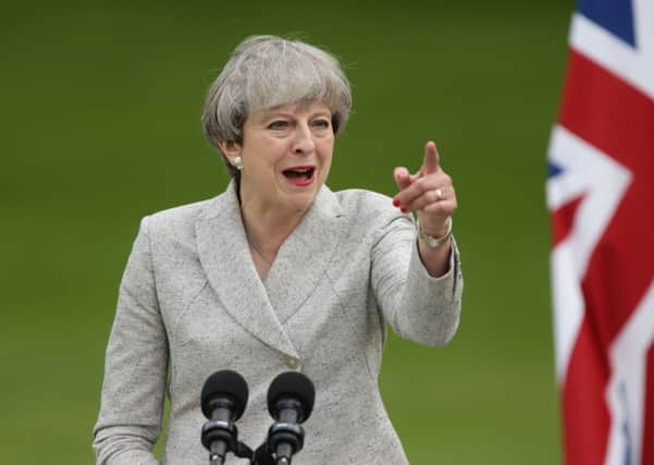 Prime Minister Theresa May speaks at a joint press conference with French President Emmanuel Macron at the Elysee Palace during her visit to Paris, France. PIC: PA