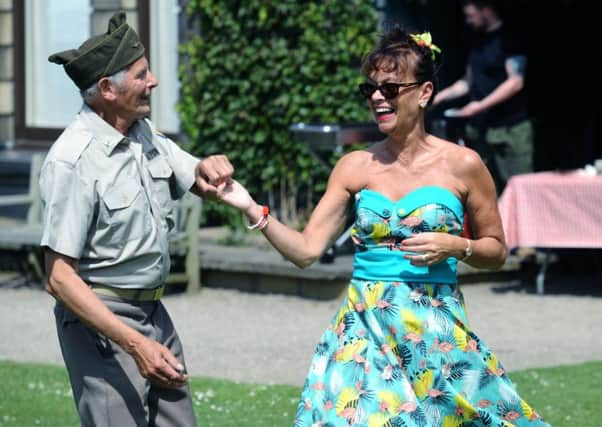 Two visitors get into the swing at Lotherton Hall. Picture: Jonathan Gawthorpe