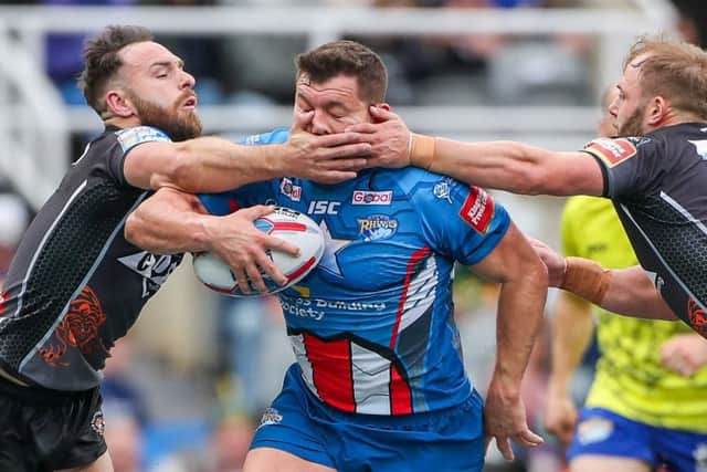 Leeds' Brett Ferres is tackled by Castleford's Luke Gale and Paul McShane during the rivals' Magic weekend clash at St James's Park. Picture: Alex Whitehead/SWpix.com