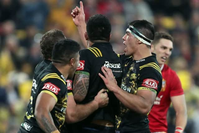 Hitting back: Hurricanes' Vaea Fifita  celebrates scoring his side's fourth try.