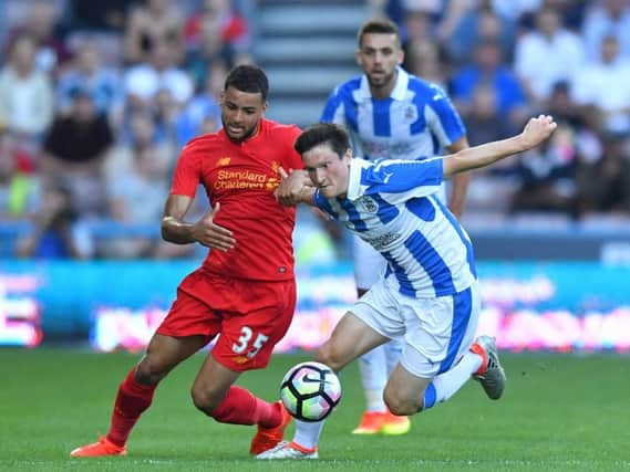 Liverpool midfielder Kevin Stewart in action against Huddersfield Town last season