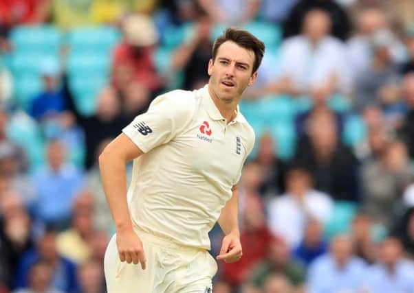 England's Toby Roland-Jones celebrates after bowling out South Africa's Quinton de Kock. Picture: Adam Davy/PA