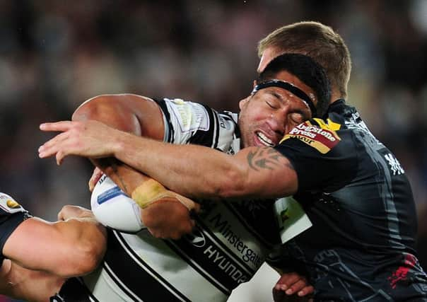 Mickey Paea, seen being tackled by Wigan's Michael McIlorum in 2015, is returning to Hull FC (
Picture: Jonathan Gawthorpe).