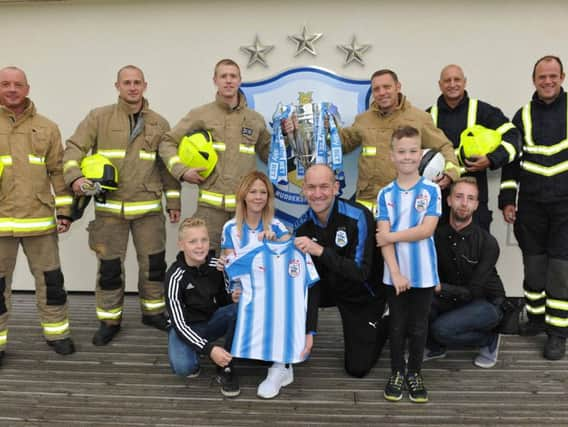 Mason receiving his new shirt.