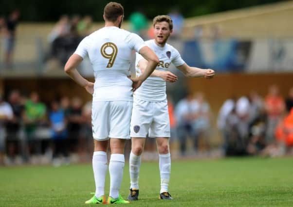 Eunan OKane talks tactics with Leeds United team-mate Chris Wood ahead of last months friendly with Borussia Monchengladbach (Picture: Jonathan Gawthorpe).