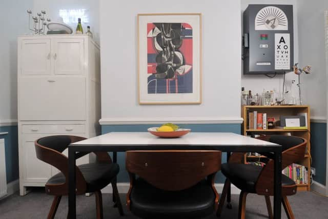 The dining area with vintage dresser and 1960s Danish dining table