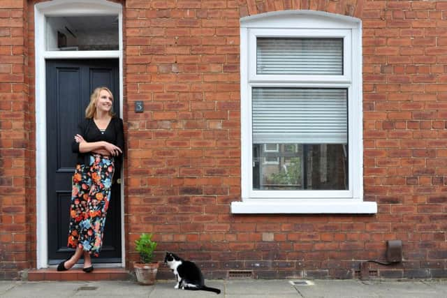 Lotte outside het home in York. The plastic door was replaced with an original Victorian one