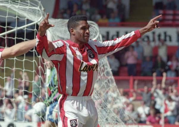 Brian Deane: Celebrating his historic goal.