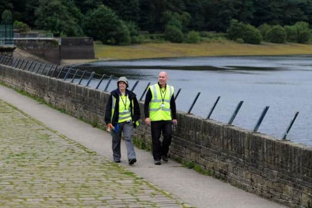 Jeff Platts and Helen Mariott on patrol at Ogden Water. Pic: Jonathanm Gawthorpe