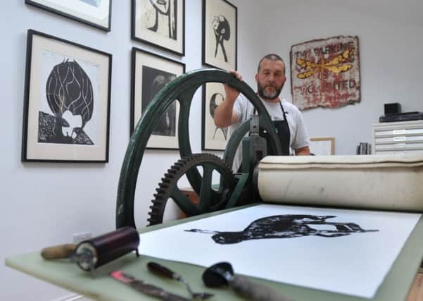 Andrew in his home studio