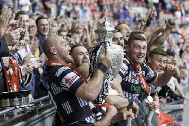 Gareth Ellis gets ready to hold the Challenge Cup trophy aloft (Picture: SWPix.com)