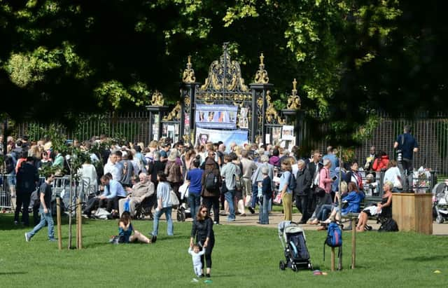 Flowers and tributes mark the 20th anniversary of the death of Diana, Princess of Wales, outside Kensington Palace in London.