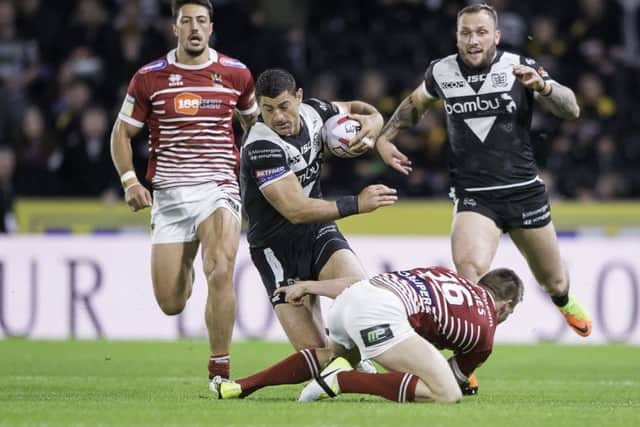 Hull FC's Mark Minichiello tries to make a break.