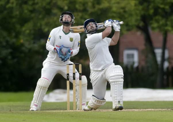 Irfan Amjad who scored 20  for Pudsey Congs looks to the sky but the ball was caught by Richard Atkins off the bowling of David McCallam.  New Farnley won by one run to relegate Pudsey Congs