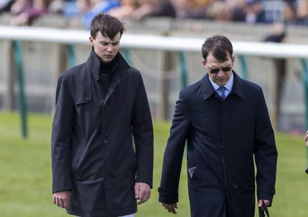 Trainer Aidan O' Brien,  with his jockey son Joseph. Picture: Julian Herbert/PA