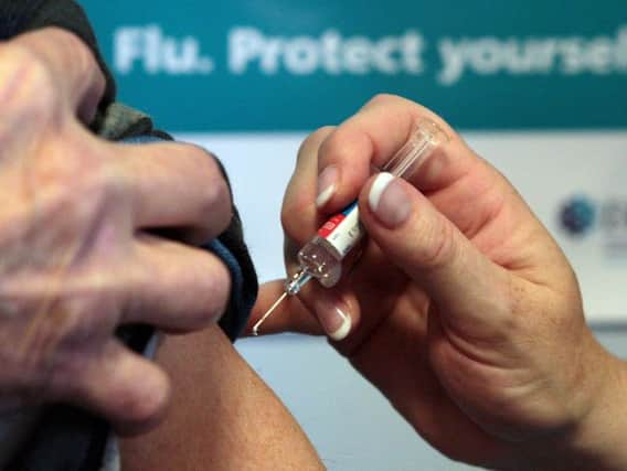 Patient receiving fly jab - Credit: David Cheskin/PA Wire