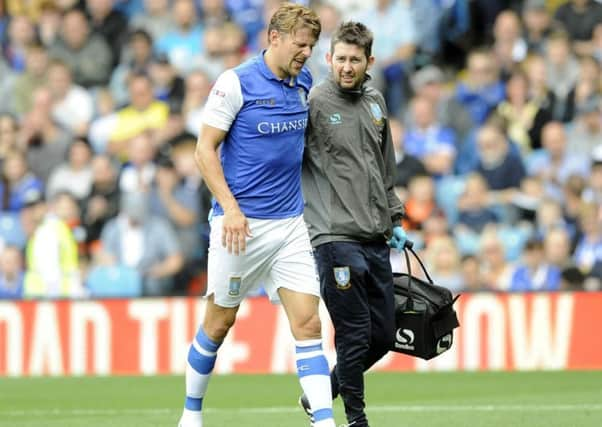 Glenn Loovens was forced off with a back injury in the draw with QPR on the second Saturday of the season (Picture: Steve Ellis)