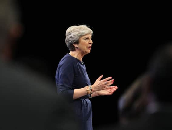 Theresa May giving her keynote speech in Manchester. PA