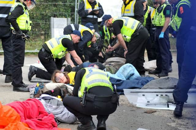 27 September 2017......     North Yorkshire Police work to free protestors chained together in the entrance to Third Energy's fracking site in Kirby Misperton near Malton. Picture Tony Johnson.