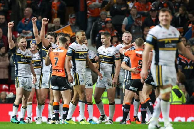 TURNAROUND: Leeds Rhinos' players celebrate their win at Old Trafford on Saturday. Picture by Alex Whitehead/SWpix.com