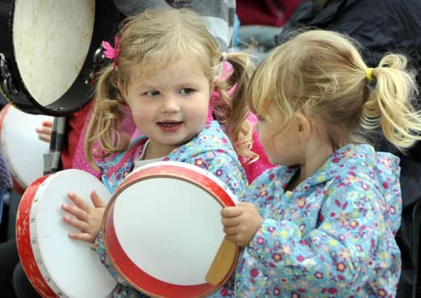 ENGAGING: Children having fun at a picnic and being creative.  Picture by Andrew Higgins