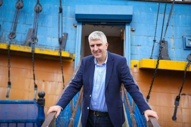 Andrew Fiddler in front of the replica of HM Bark Endeavour which will set sail for Whitby next year.