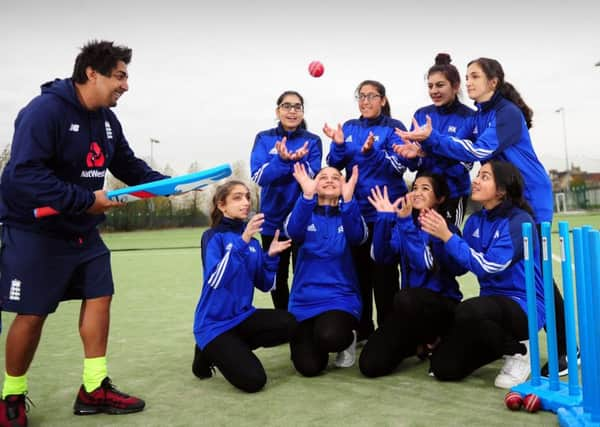 Catch of the day: Members of Carlton Bolling Colleges girls cricket team with coach Zaheer Jaffary. (JPress).