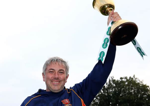 Chris Silverwood holds the tropy aloft after Essexs County Championship win in the summer (Picture: Steven Paston/PA Wire).