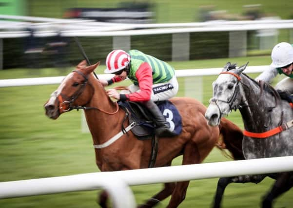 Race winner Forest Bihan, left, ridden by jockey Aidan Coleman in the Sky Bet Lightning Novices' Steeple Chase at Doncaster (Picture: Danny Lawson/PA Wire).