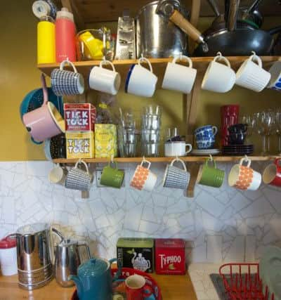 The kitchen with its cut-price mosaic of smashed white tiles, which look fashionable and effective