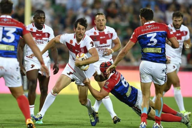 Englands Stefan Ratchford is held back by his shirt as he attempts to find a gap in the French defence (Picture: NRL Imagery).