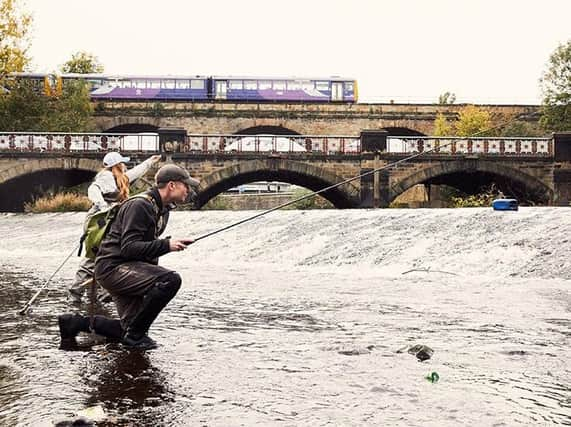 Paul and Jess fishing in the middle of Sheffield. (Photo: Tom Cockram).