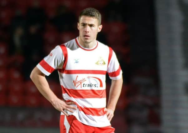 Doncaster Rovers Tommy Rowe had his penalty saved and it secured a 5-4 shoot-out victory for Rochdale at Spotland (Picture: Marie Caley).