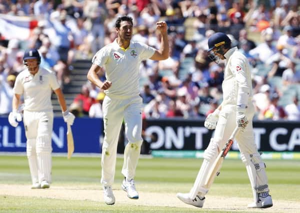 GOT HIM: Australia's Mitchell Starc celebrates the wicket of England's Craig Overton at the Adelaide Oval. Picture: Jason O'Brien/PA