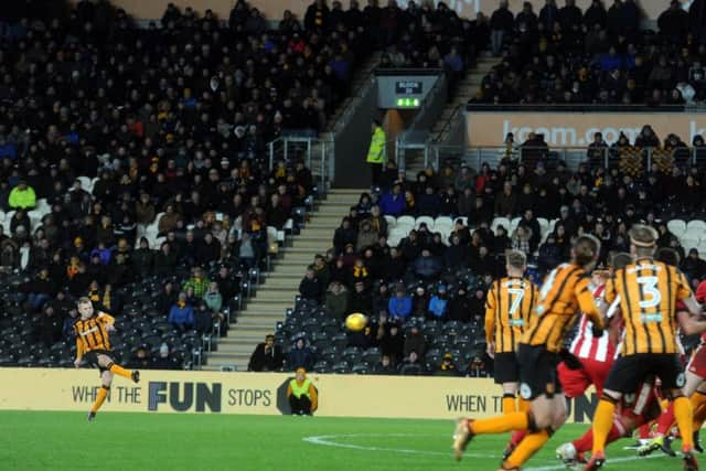 Seb Larson curles home a free-kick to put Tigers in front.