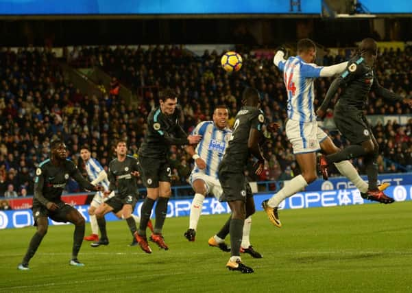 Huddersfield Towns Steve Mounie gets his head to the ball but was unable to find the target as his side lost at home to champions Chelsea (Picture: Bruce Rollinson).