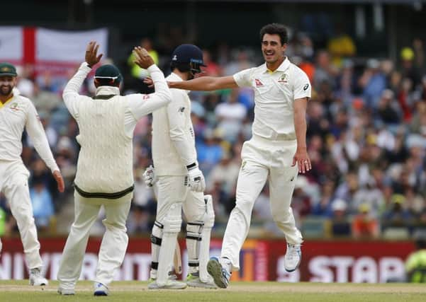 ALL ENDS UP: Australia's Mitchell Starccelebrates the wicket of England's James Vince with his team-mates at the WACA. Picture: Jason O'Brien/PA