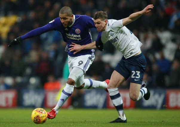 Sheffield Uniteds Leon Clarke, left, duels with Preston North Ends Paul Huntingdon during Saturdays Championship match at Deepdale (Picture: Simon Bellis/Sportimage).