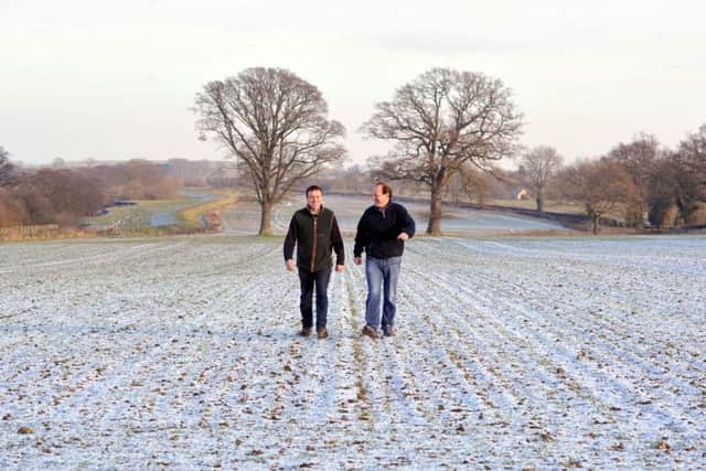 Richard and Max walk the land at Ness Hall.