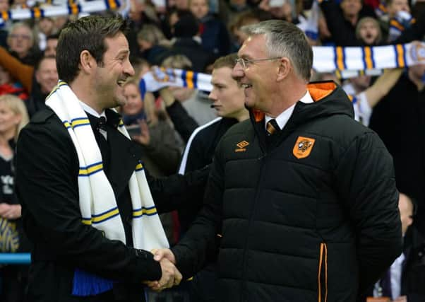 Hul City boss Nigel Adkins with his Leeds United counterpart Thomas Christiasen at Elland Road last weekend. PIC: Bruce Rollinson