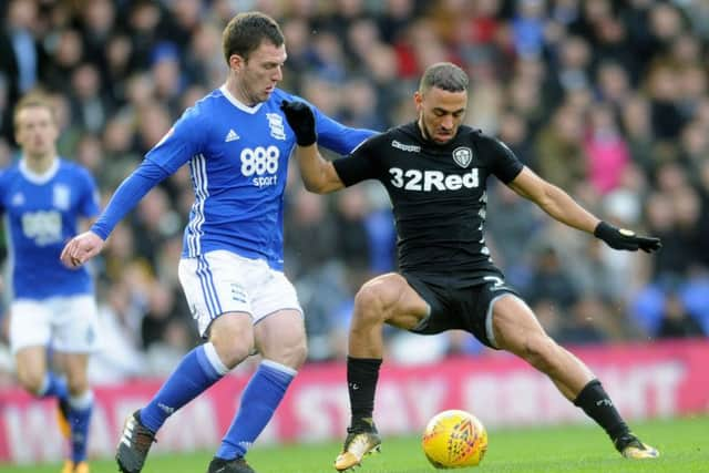 HOLD OFF: Leeds 
United's Kemar Roofe gets away from City's Craig Gardner. Picture: Jonathan Gawthorpe.