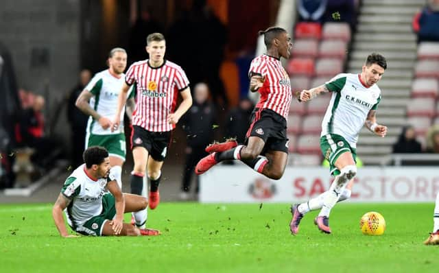 Barnsley's Adam Hammill, right, gains possession during Monday's encounter against Sunderland at The Stadium of Light. Picture: Frank Reid.