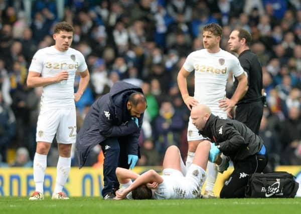 Luke Ayling receives treatment against Nottingham Forest.